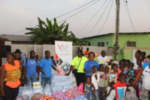 VMF Team in a group picture with children of Enough Grace Foundation 